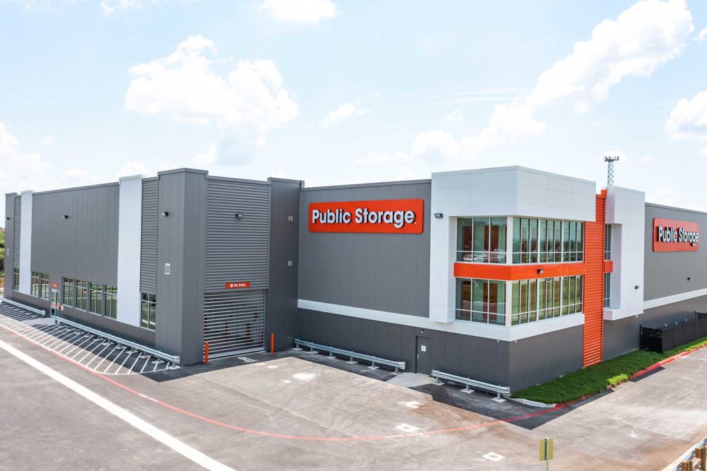 Multi-story self storage building corner view with display doors and Public Storage signage
